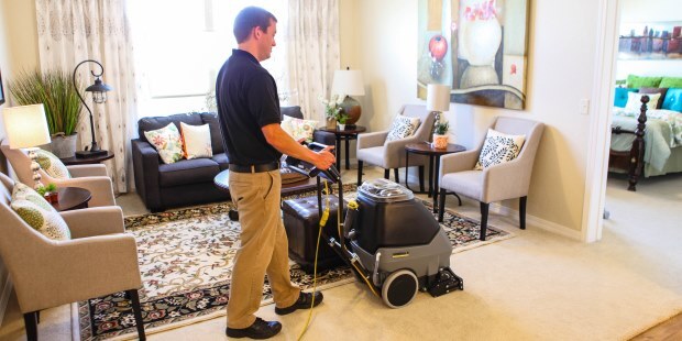 Cleaning hotel room with Windsor Admiral 8 carpet extractor